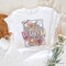 Floral Mama Coquette Bow Pastel T-Shirt, White and Natural Boho Tee With Spring Flower